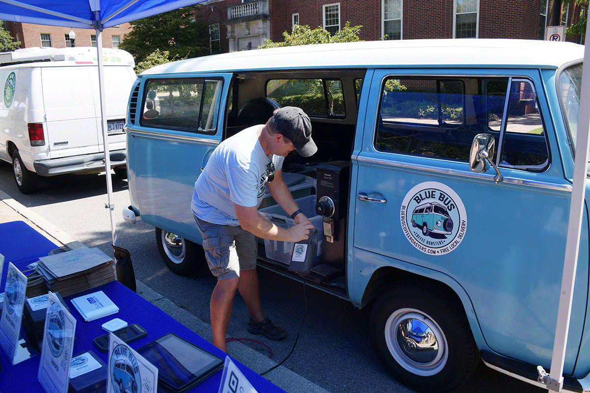 Man gets coffee beans from a VW bus