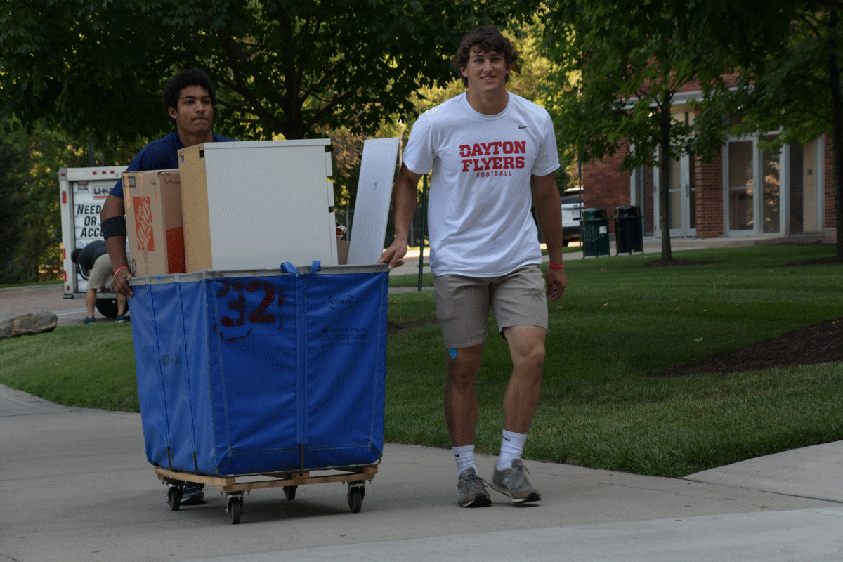 Two members of the UD football team pitched in to help with move-in.