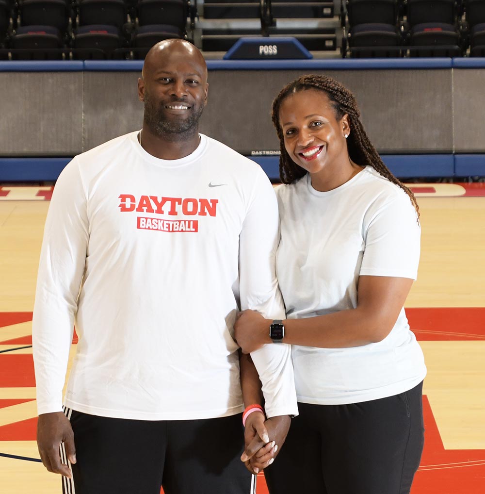 Richard and Tamika Williams Jeter stand on the UD Arena court