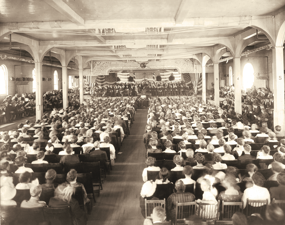 Old photo of the 1914 graduation at UD, then known as St. Mary's College. Ceremony in the old gym.