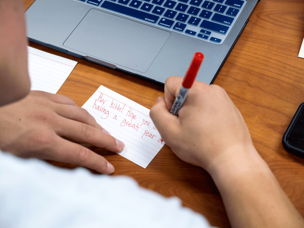 Student writes on notecard