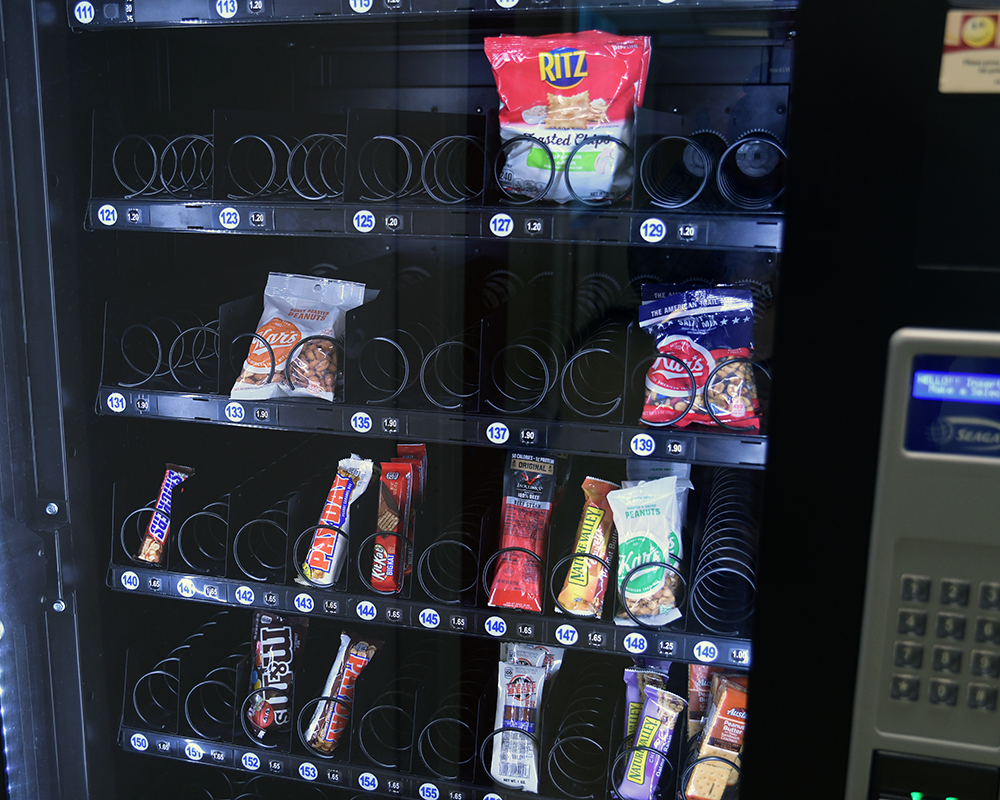 A vending machine nearly empty of snacks