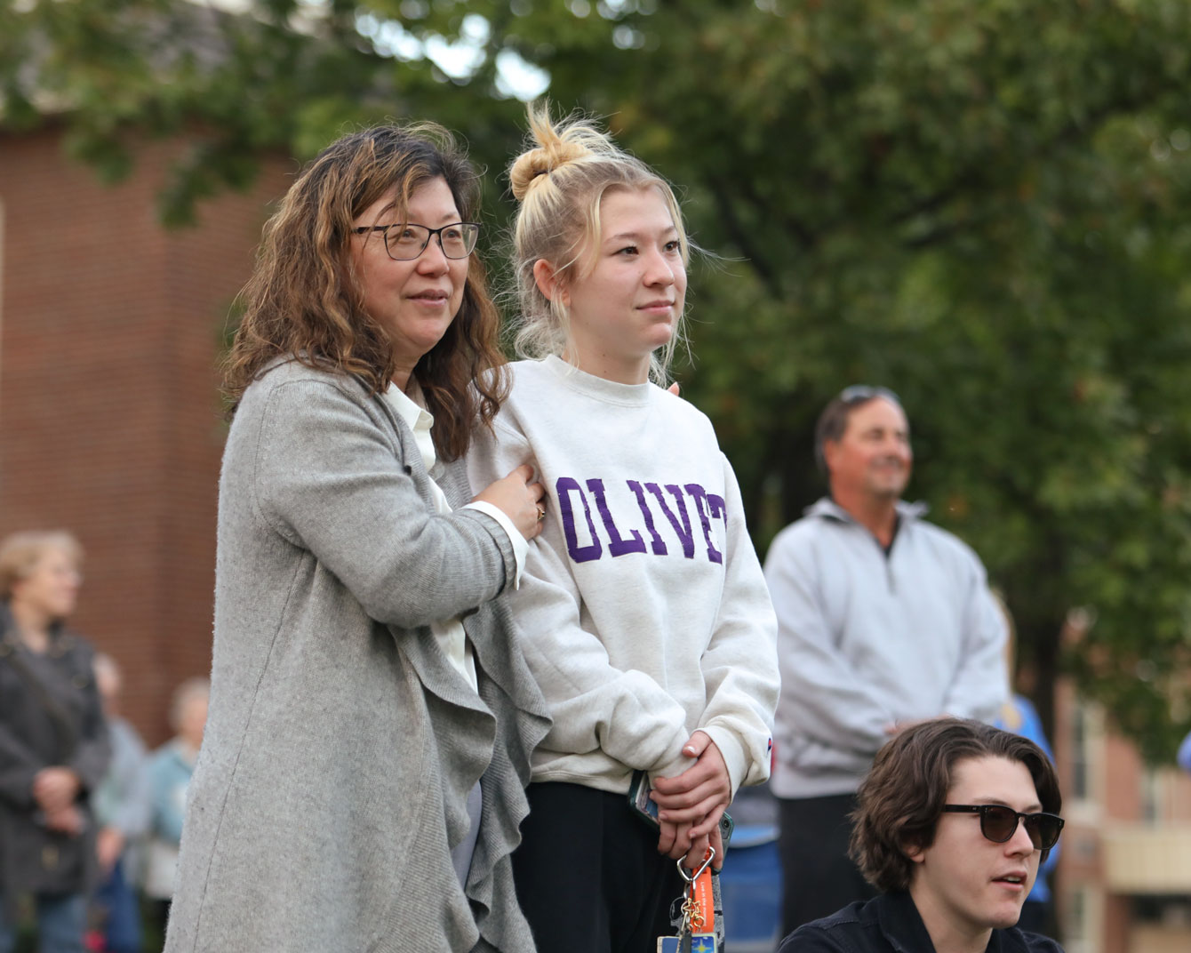 A mother and daughter watch the band perform.