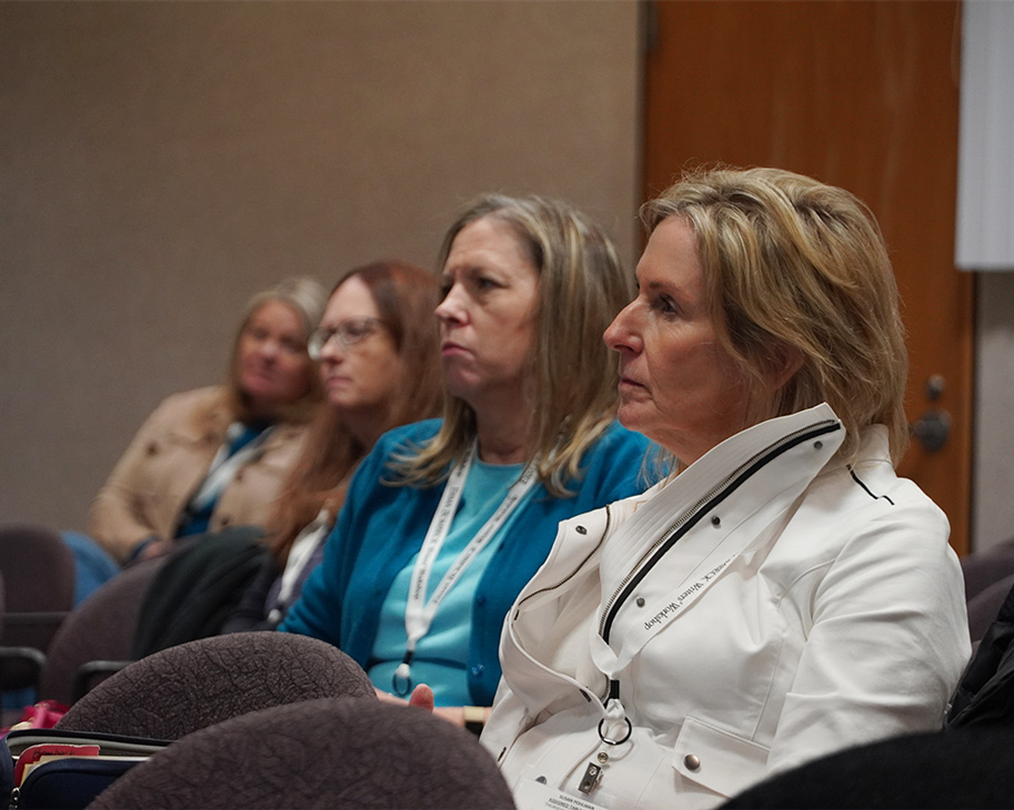 Attendees sit and listen in a sessions at the Erma Bombeck Writers' workshop