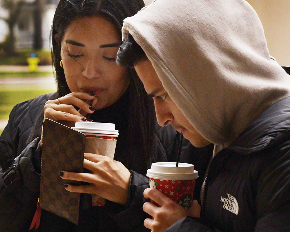 Two students drinking coffee
