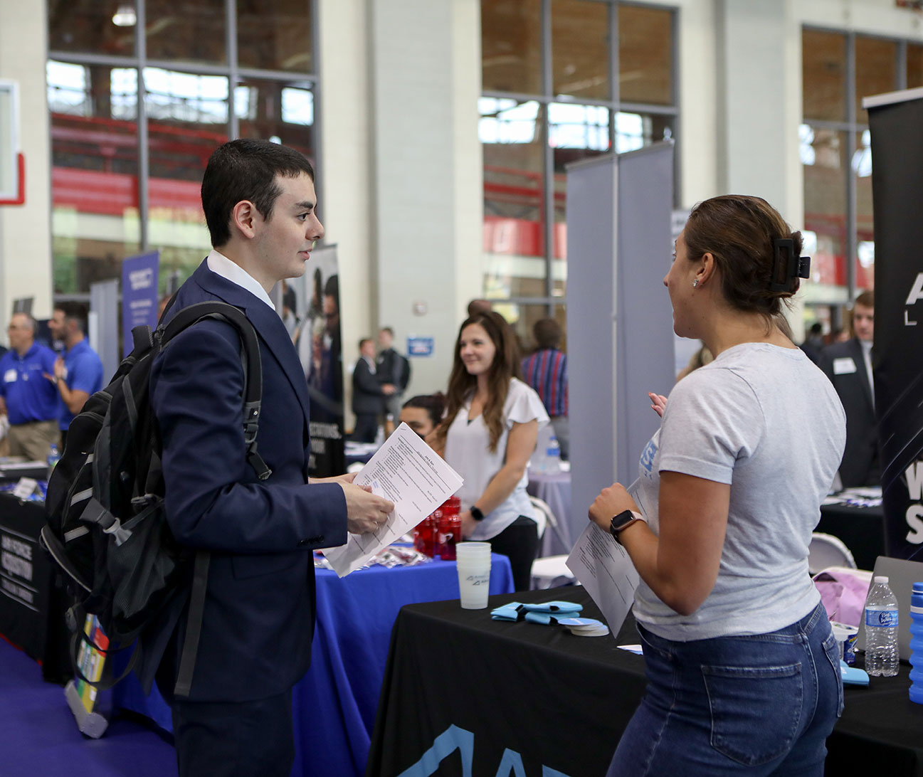 A student chats with a recruiter.