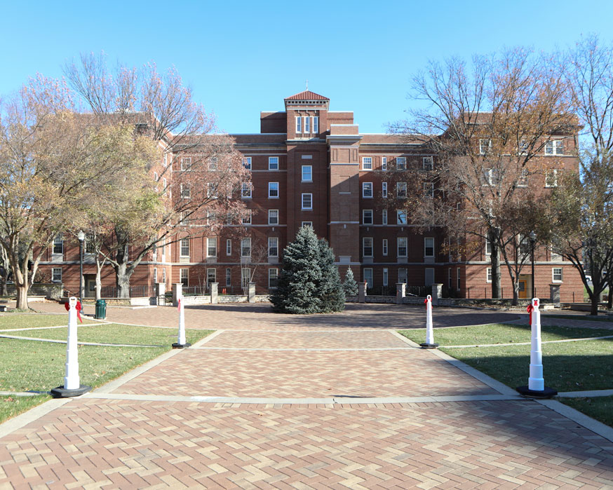Humanities Plaza is decorated with a Christmas tree, lights, and red bows.