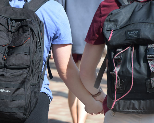 Students holding hands