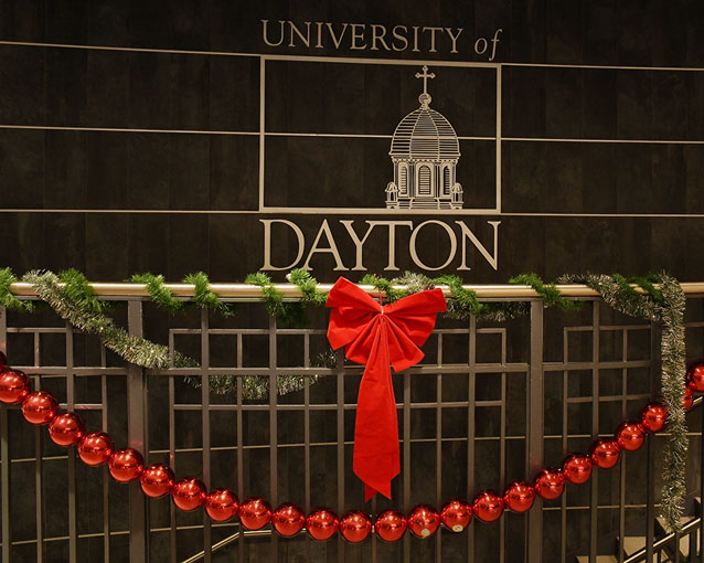A railing is decorated with ornaments and garland