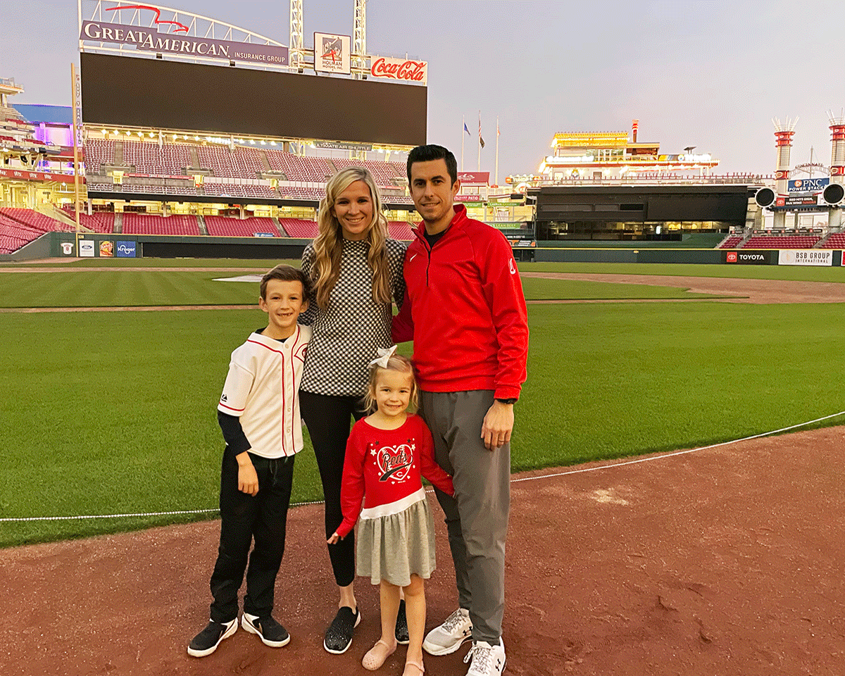 Call stands with her family on the Reds field.