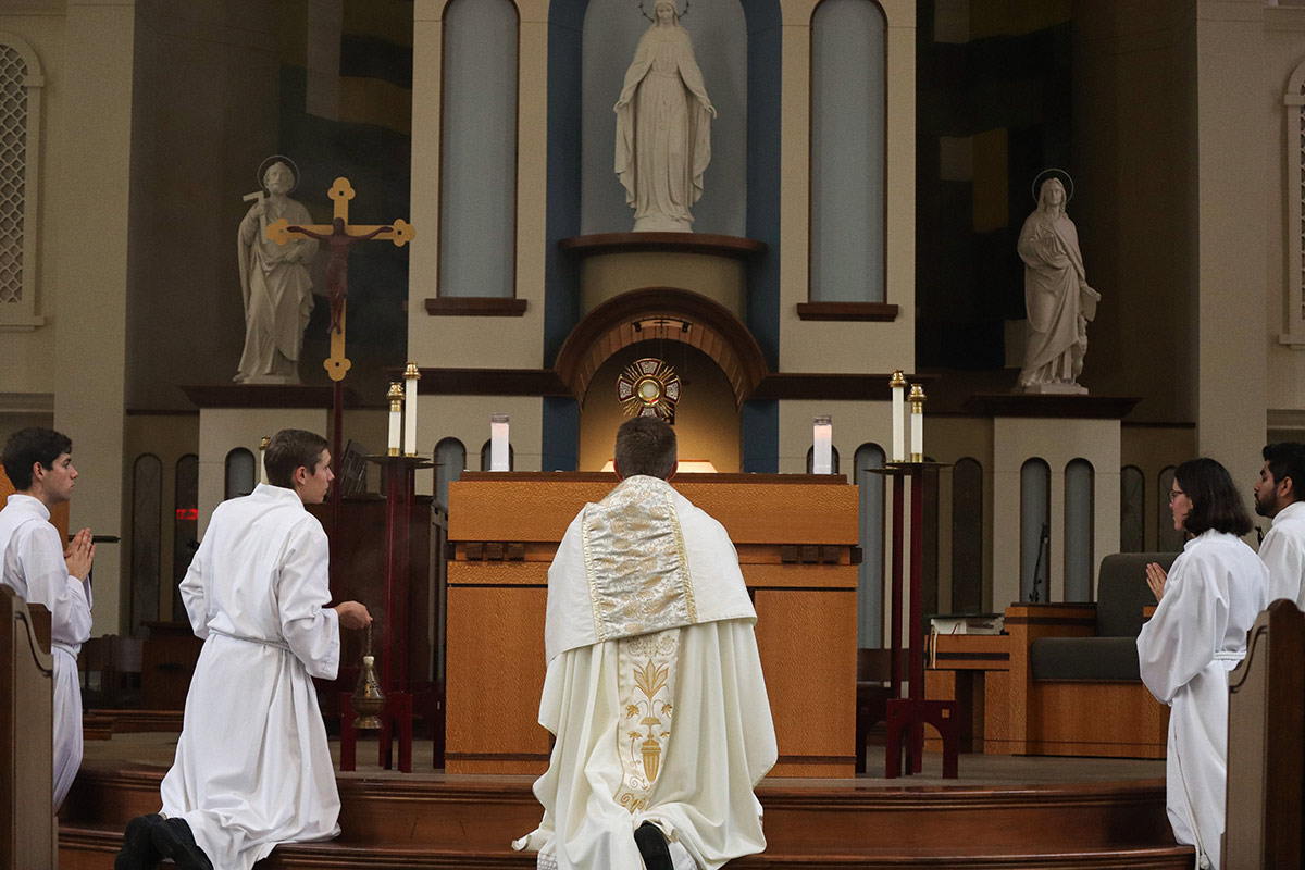 Priest starting a prayer.