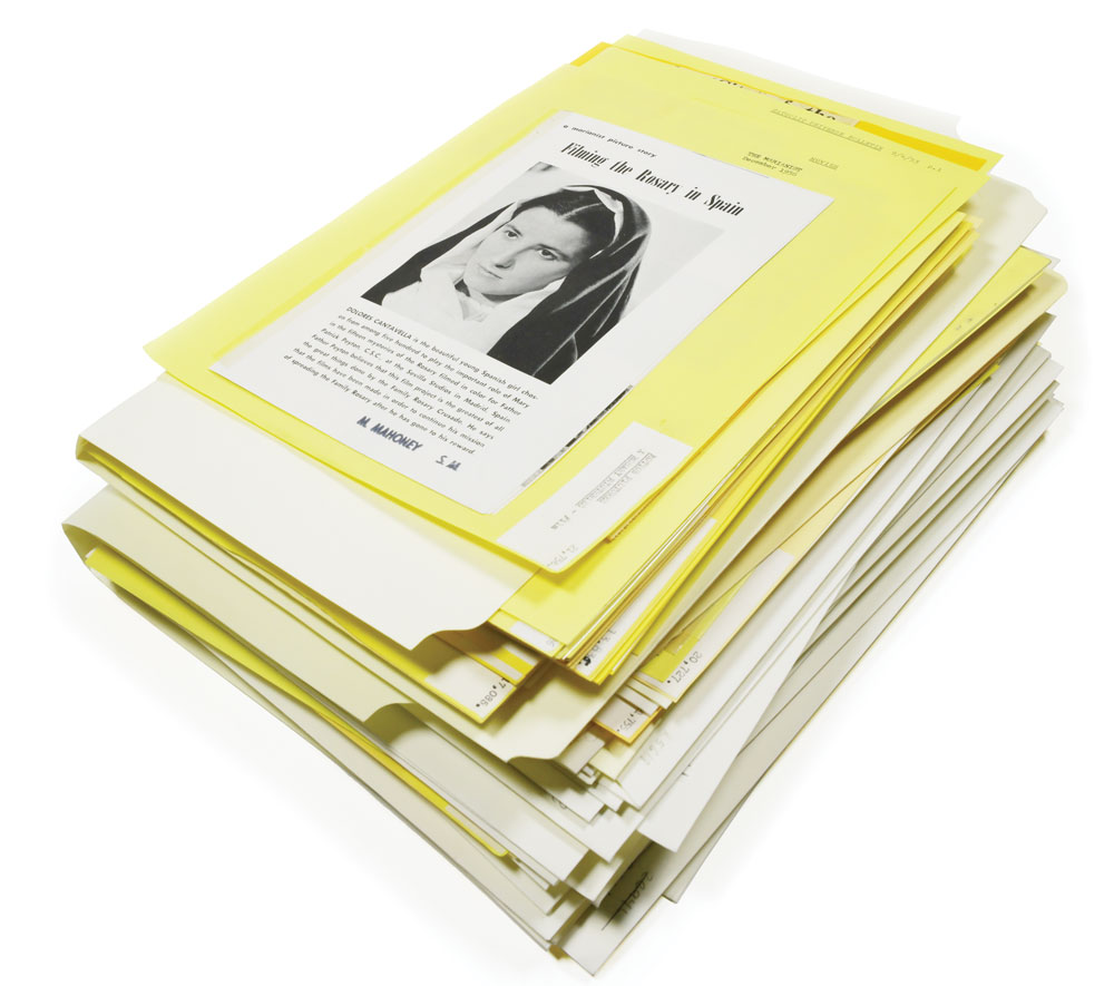 Stack of old files and papers on Mary