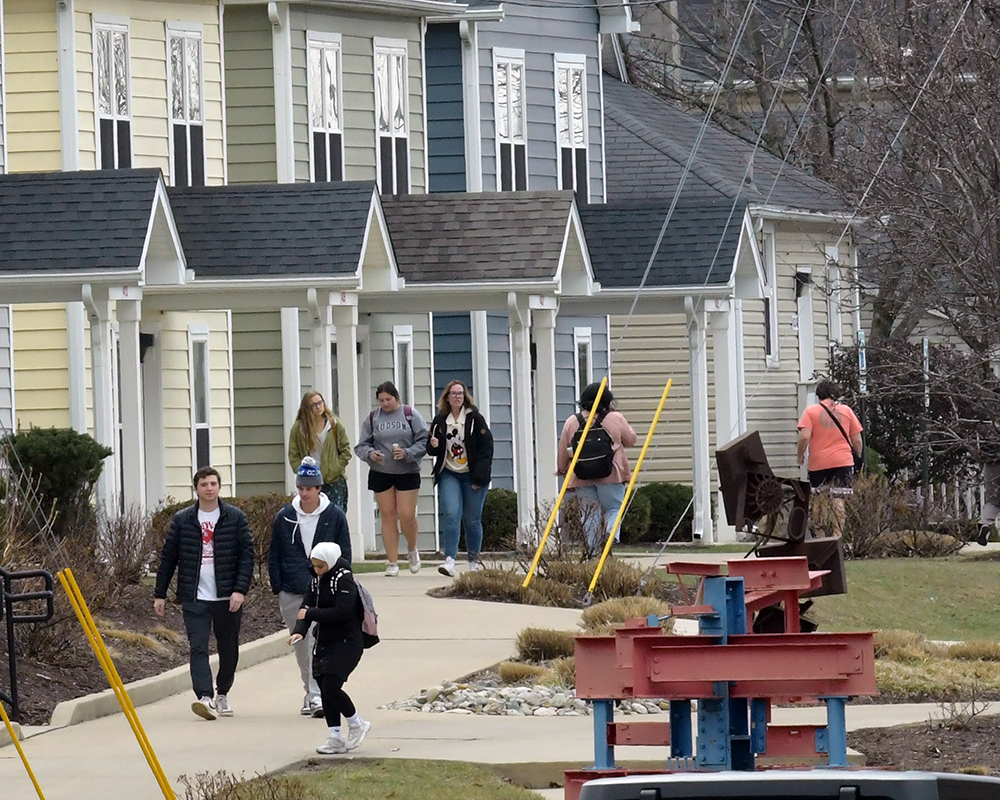 Students walk to class through the student neighborhood