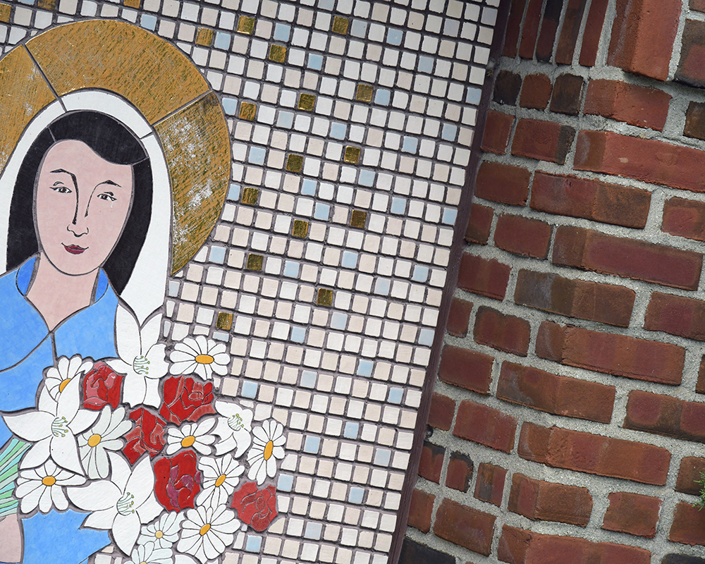 Tile artwork of Mary holding flowers