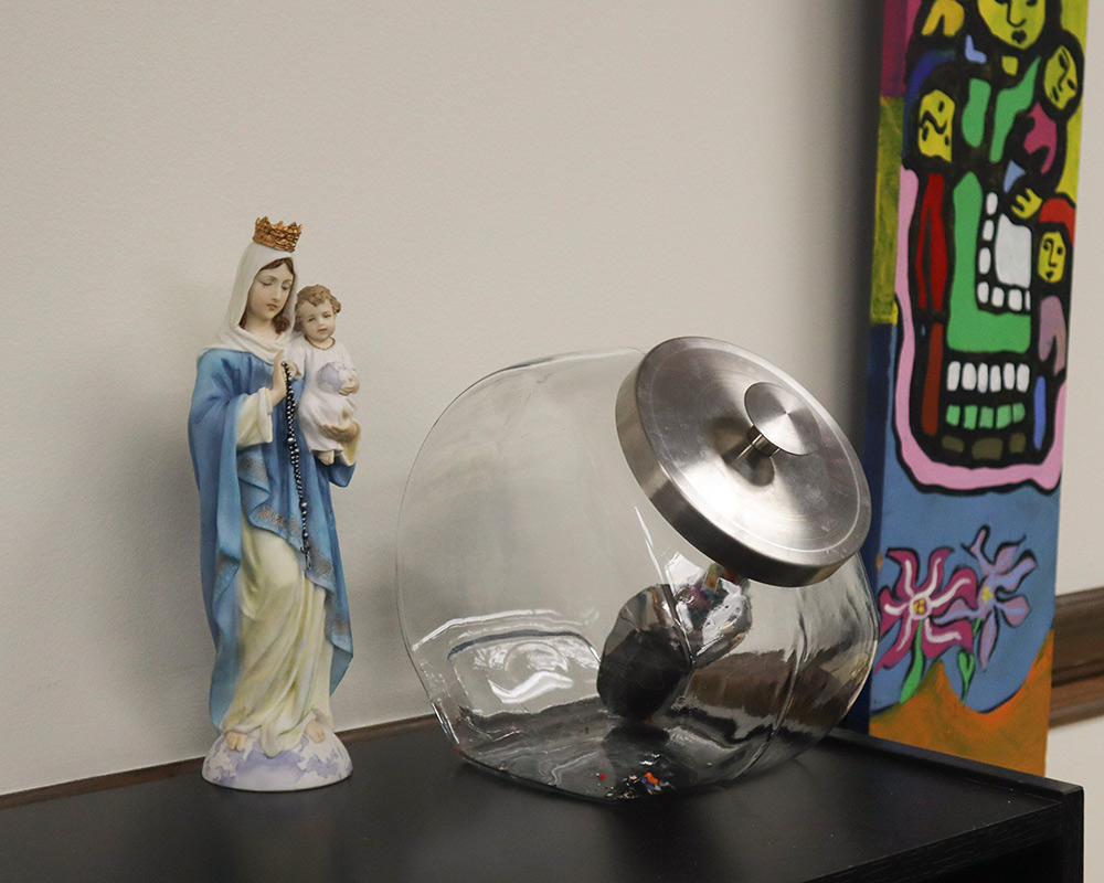 Mary statue and M&M Jar