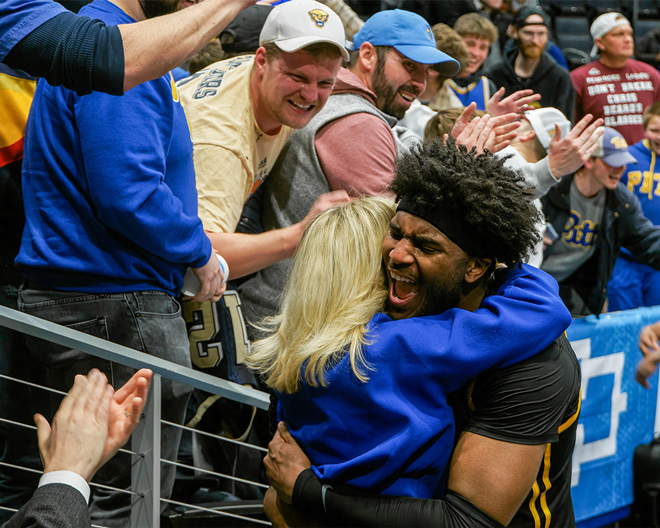 A player and fan embrace.