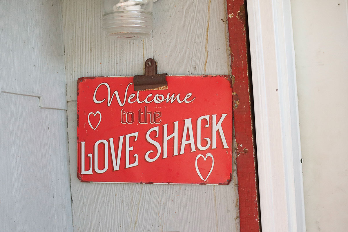 Sign that reads "Welcome to the Love Shack."