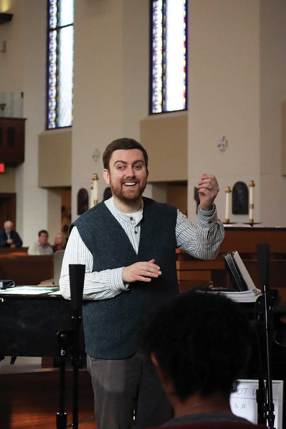 Brendan Paeplow singing during a church service.