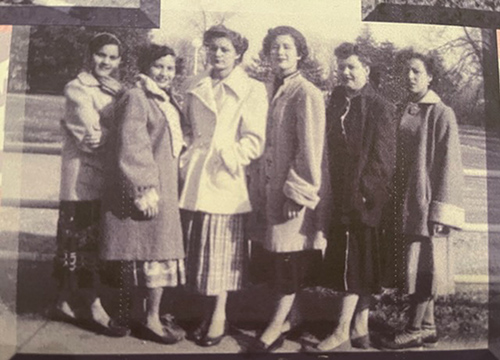 Group photo of the women together in black and white.