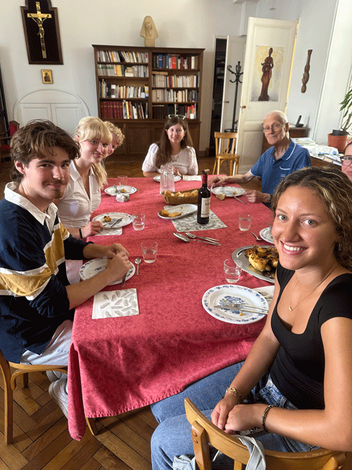People gather around a table for a meal