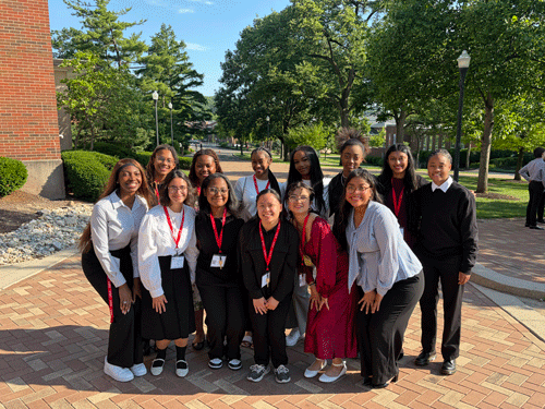 Students from the STEM Summer Bridge Program gather for a photo on campus.