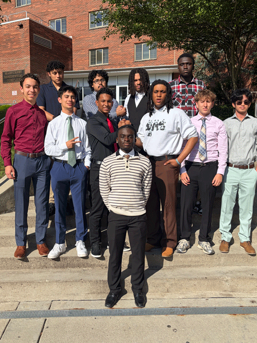 Students from the STEM Summer Bridge Program gather for a photo on campus.
