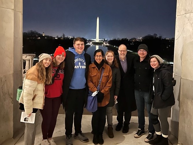 Group at Lincoln Memorial with Washington Memorial in background