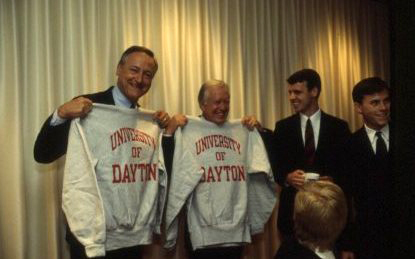 Former President Jimmy Carter and former Ohio Governor Richard Celeste receive University of Dayton sweaters.
