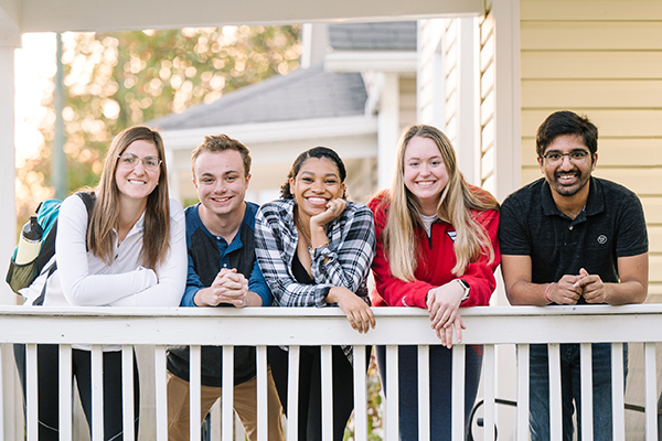 Diverse group of students on a UD porch