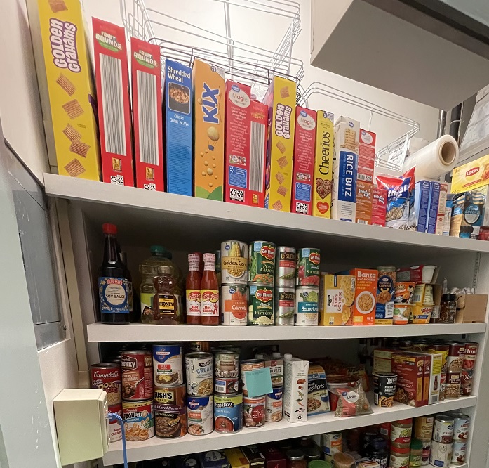 The Food4Flyers Food Pantry with shelves stocked with items for UD Students