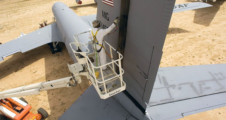 Application of protective sealant on the tail of a KC-135E Stratotanker. (Photo courtesy US Air Force)