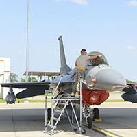 Staff Sgt. Cody Brown, 138th Maintenance Squadron, polishes the canopy of an F-16 fighter