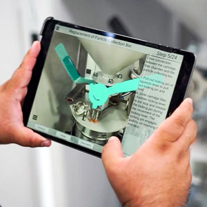 Researcher holds a tablet while using the AR app