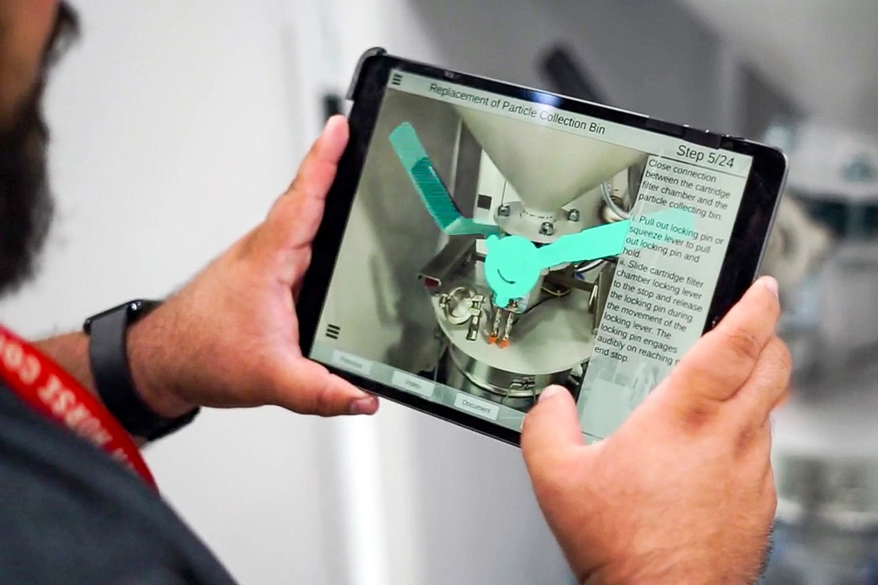 Researcher holds a tablet while using the augmented reality app.